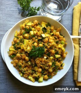 Wholesome Zucchini Chickpea Quinoa Salad with fresh zucchini, chickpeas, quinoa, and a spiced olive oil dressing in a bowl.