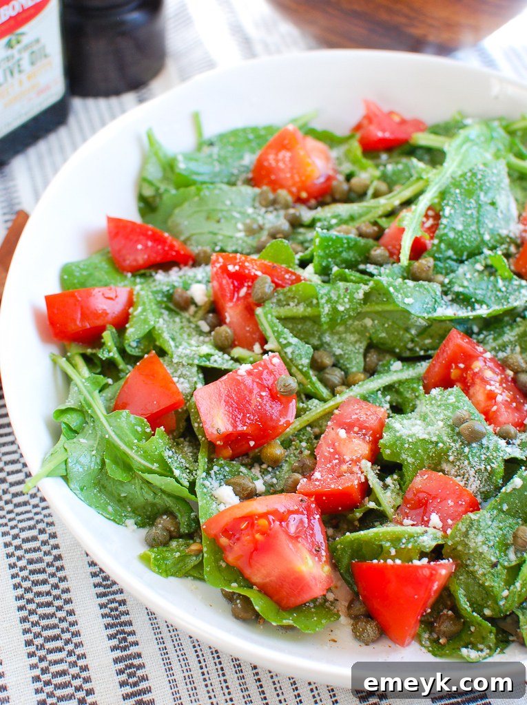 Arugula Salad with Capers in white bowl 
