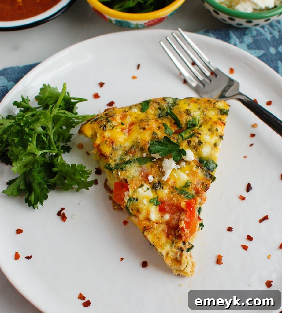 Vibrant Mediterranean Frittata on a white plate, showcasing its rich colors and textures, perfect for a healthy breakfast or brunch.