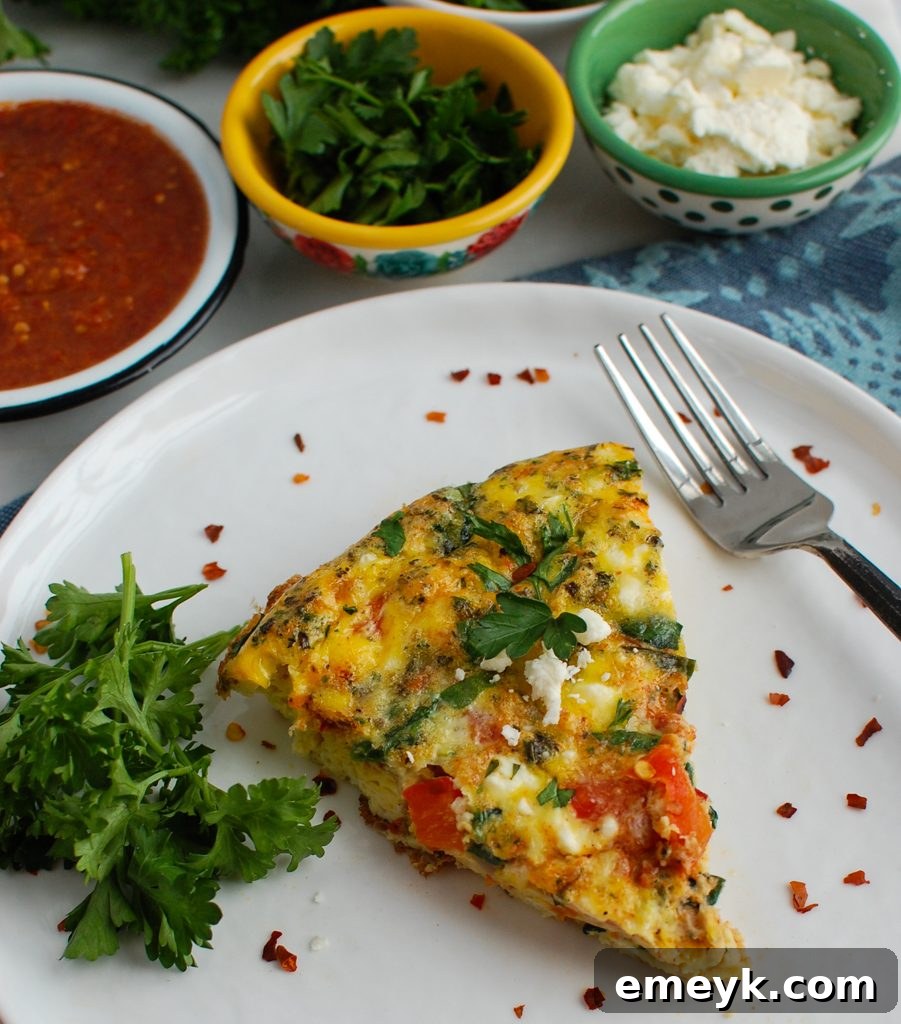 Close-up of Mediterranean Frittata garnished with fresh parsley, highlighting its vibrant toppings and inviting appearance.