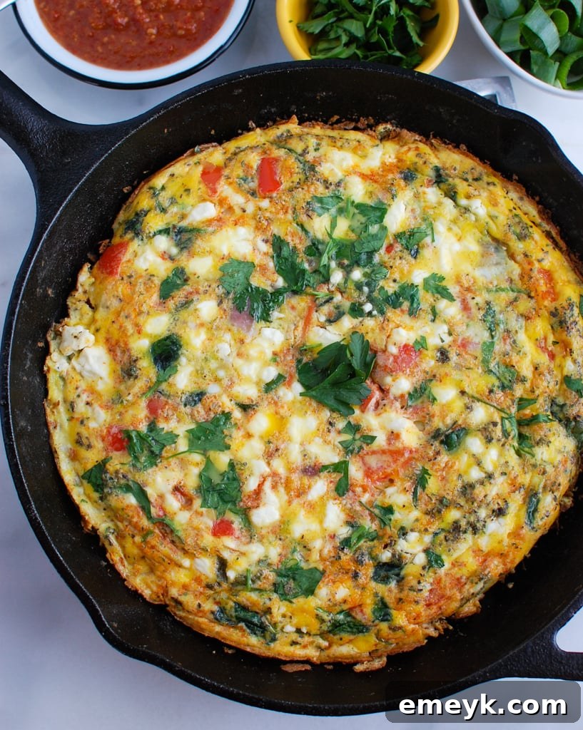 A full Moroccan Frittata, golden-brown and ready to be served, showcasing its baked perfection.