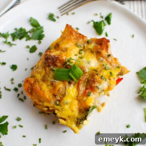 Egg Sausage Casserole with green onion garnish, a perfect breakfast dish.