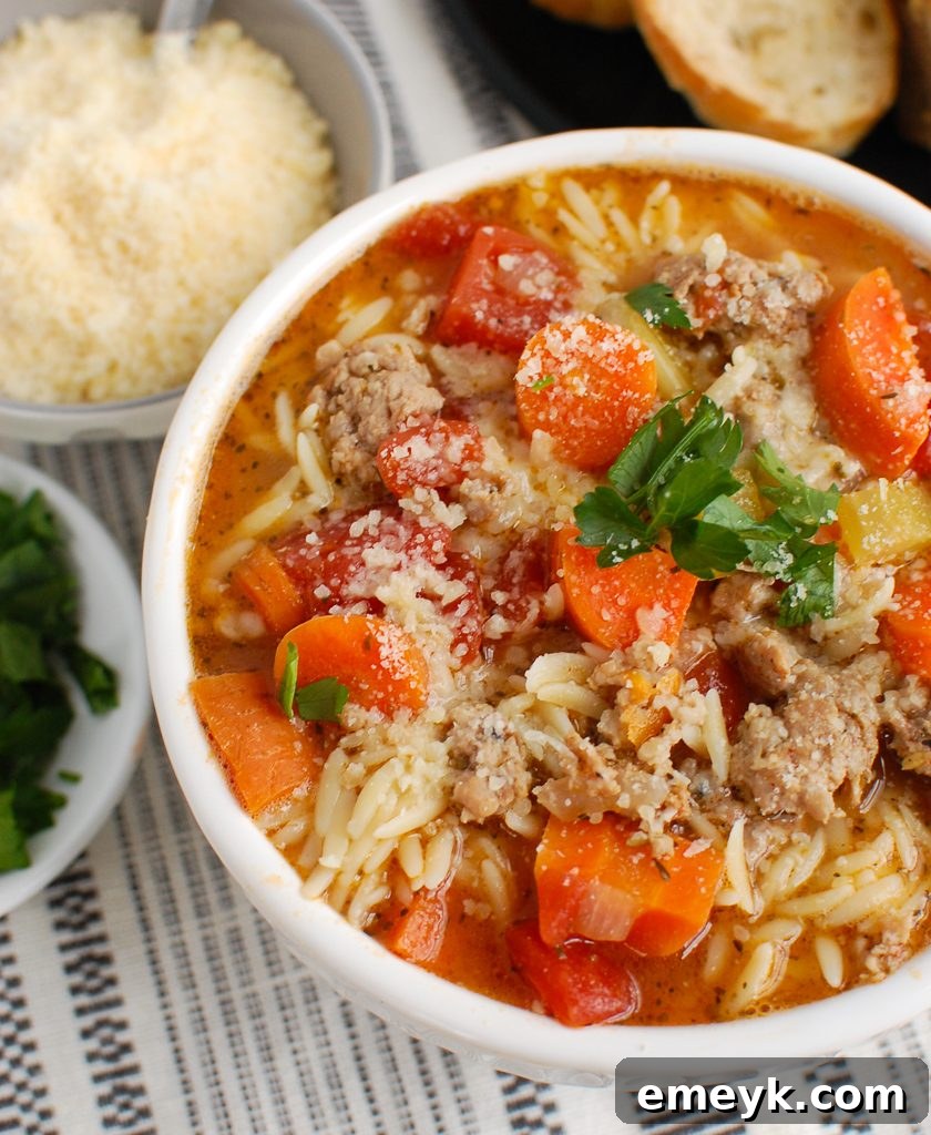 Italian Sausage Soup topped with fresh parsley, ready to be served.