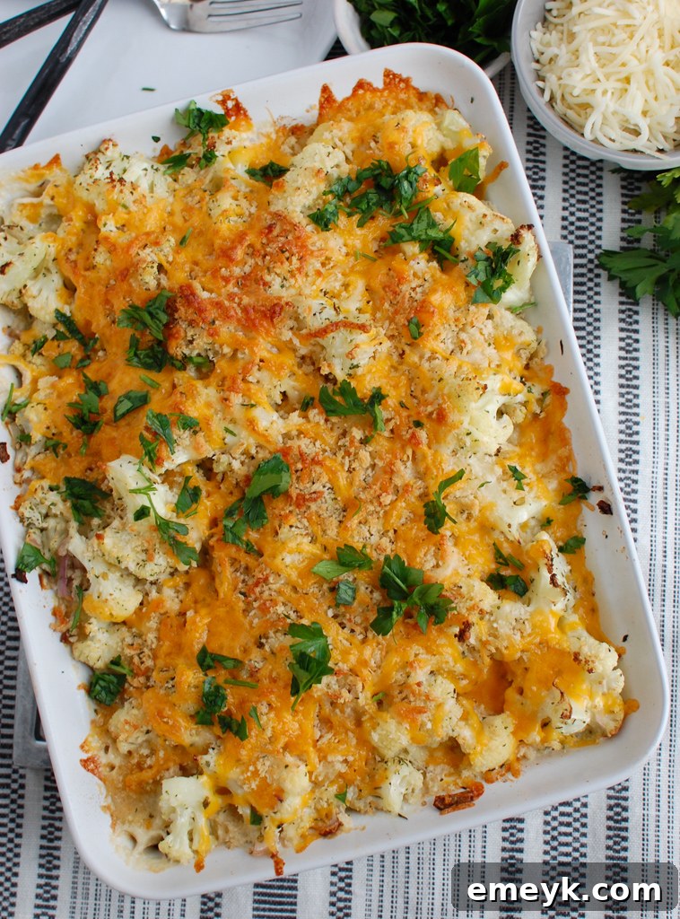 Rich and creamy Roasted Cauliflower Gratin with fresh parsley garnish, perfect for any holiday table.