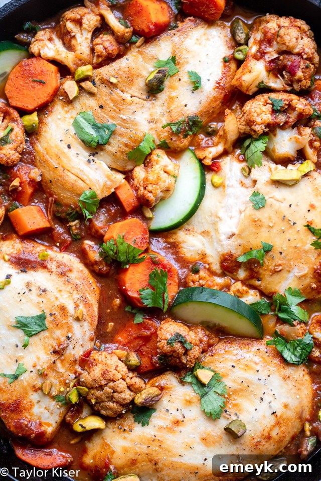 One-pan Moroccan Chicken Skillet with spices and vegetables.