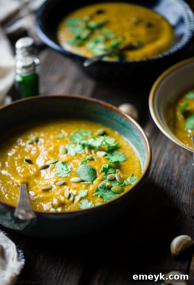 Moroccan Roasted Acorn Squash Soup, garnished with fresh herbs.