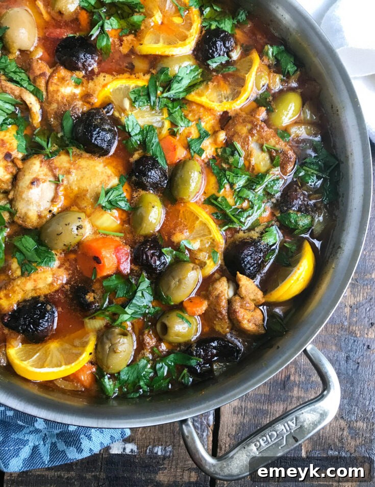 Tender Moroccan Chicken Thighs served with carrots, onions, and herbs.