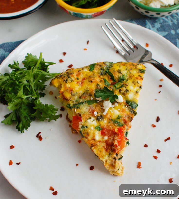 Mediterranean Frittata with Moroccan spices, topped with feta, parsley, and green onion.