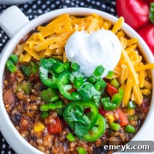 Colorful Instant Pot Vegetarian Quinoa Chili in a bowl, topped with avocado and cilantro