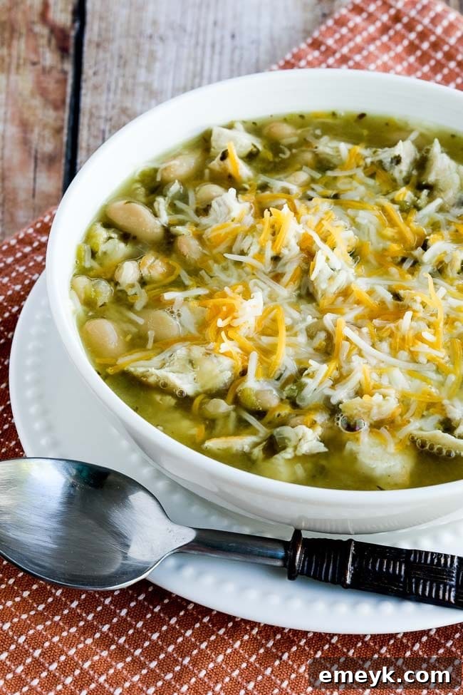 Creamy Amy's Amazing White Chicken Chili garnished with fresh green onions and lime