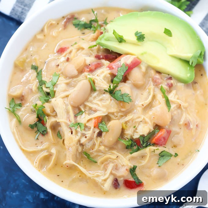 Spicy Instant Pot Chipotle Chicken Chili with a squeeze of fresh lime and cilantro