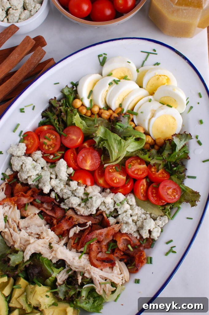 Cobb Salad highlighting the hard-boiled eggs as a key ingredient, with other colorful components visible