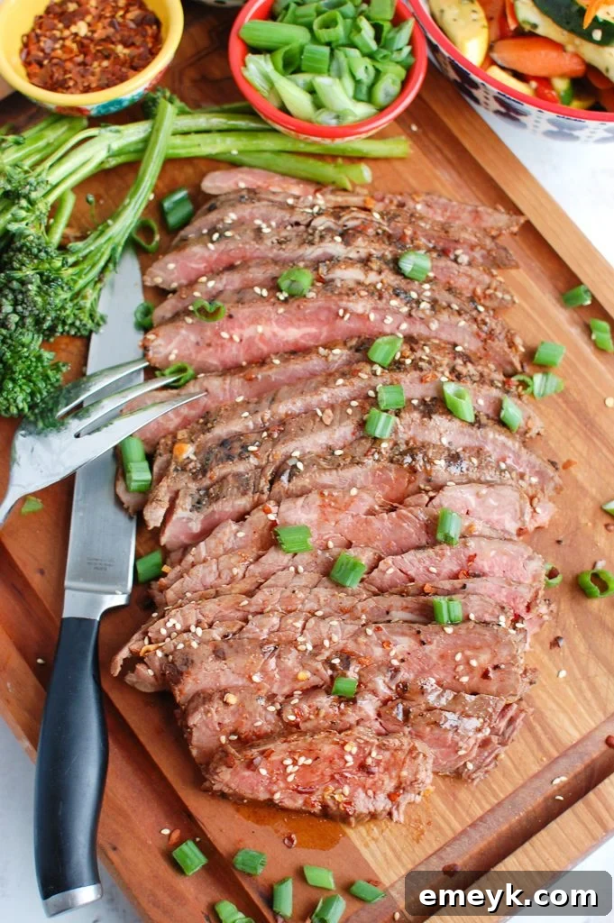 Asian Marinated Flank Steak on cutting board, freshly sliced