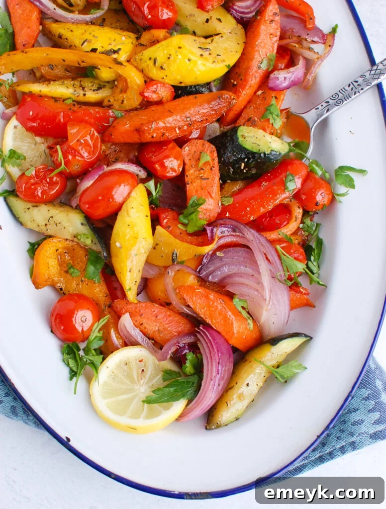 Mediterranean Roasted Vegetables with lemon slices and fresh herbs