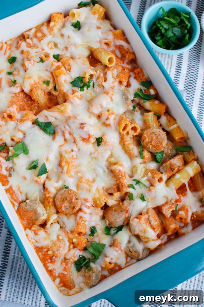 A close-up of Italian Sausage Pasta Bake garnished with fresh parsley