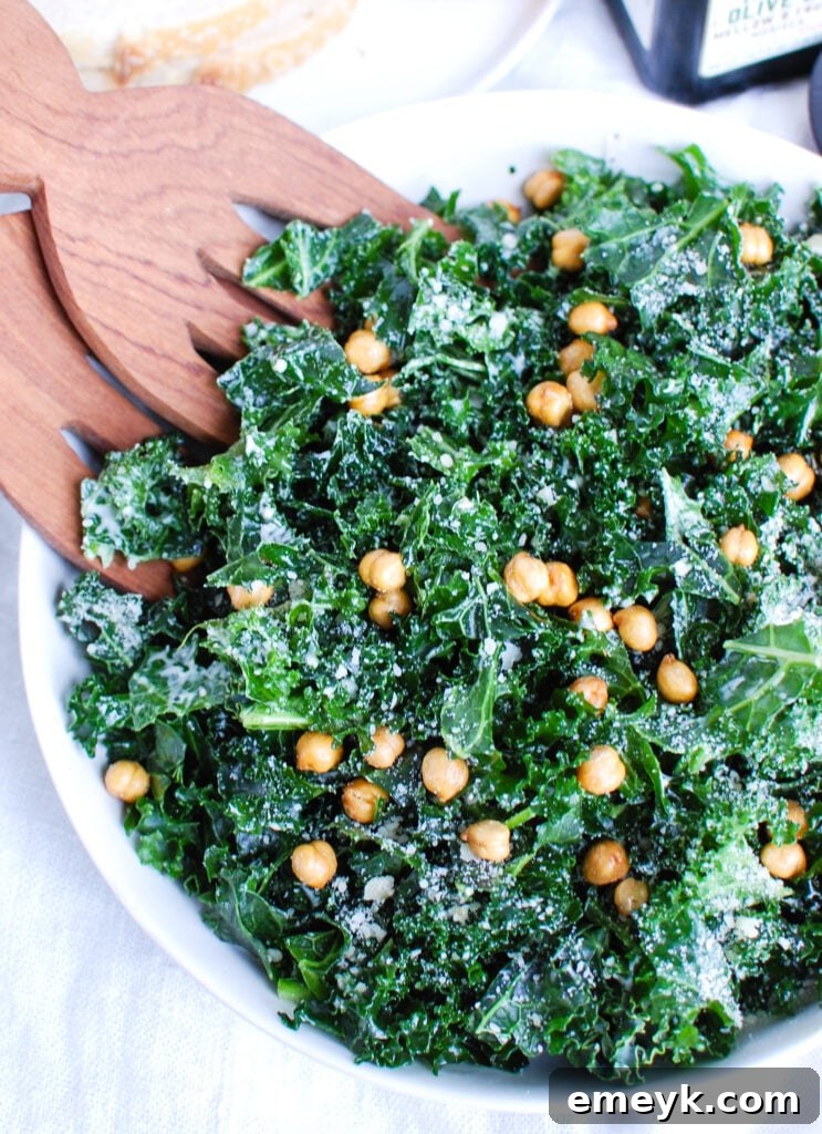 Kale Caesar Salad with wood tongs