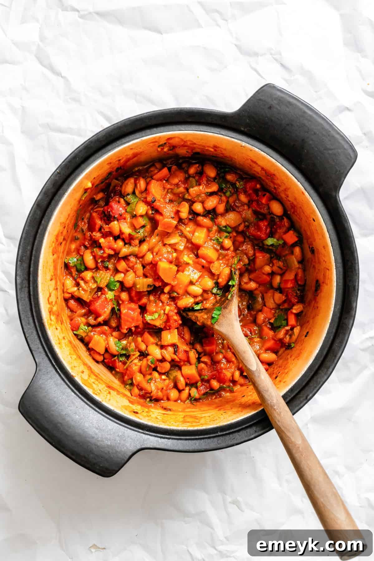 Homemade Vegetarian Chili simmering in a large pot on the stovetop