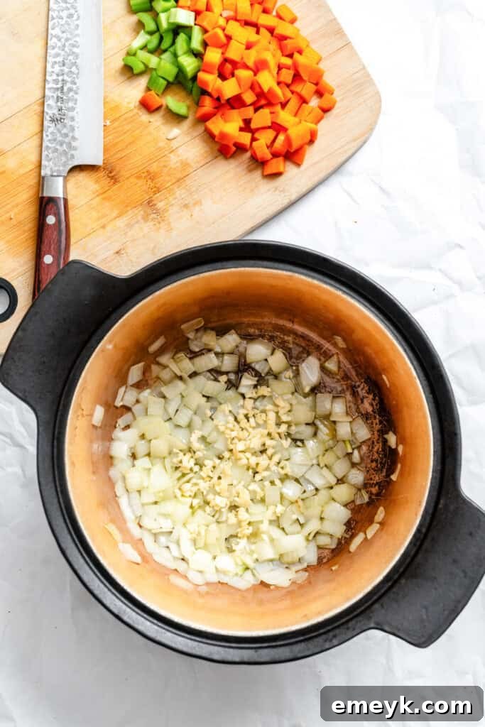 Onions sauteeing in a pot as the first step for vegetarian chili