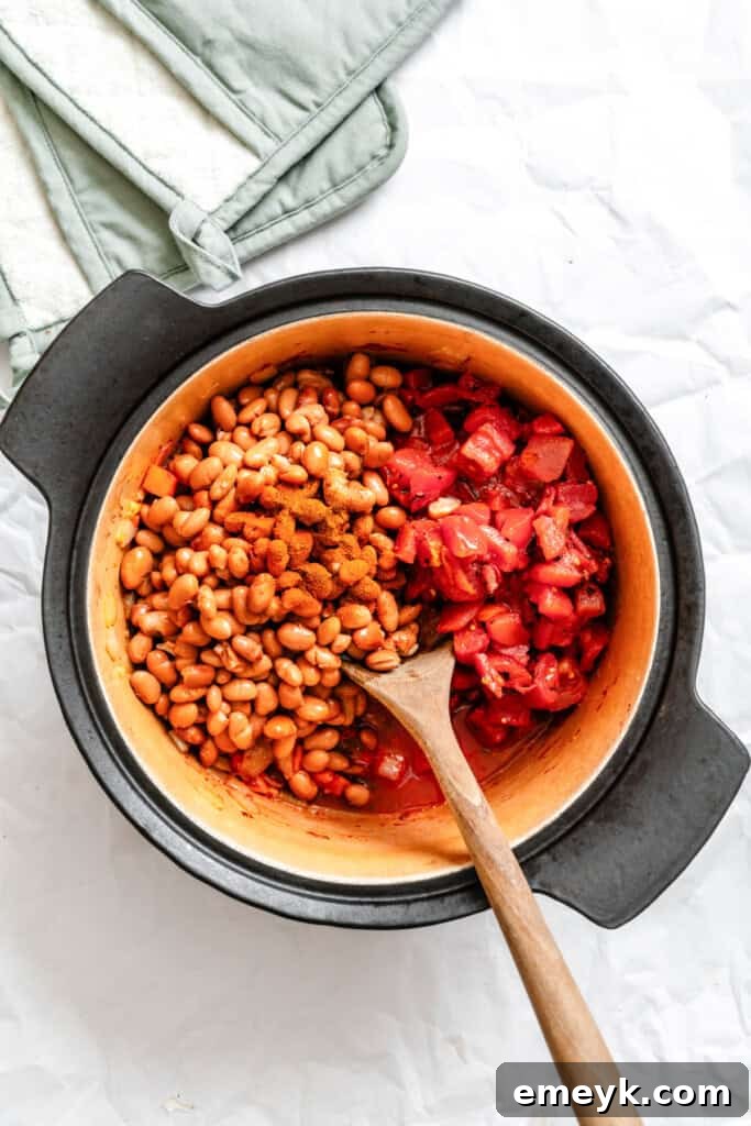 Homemade Vegetarian Chili in a pot with a spoon, showing its rich texture