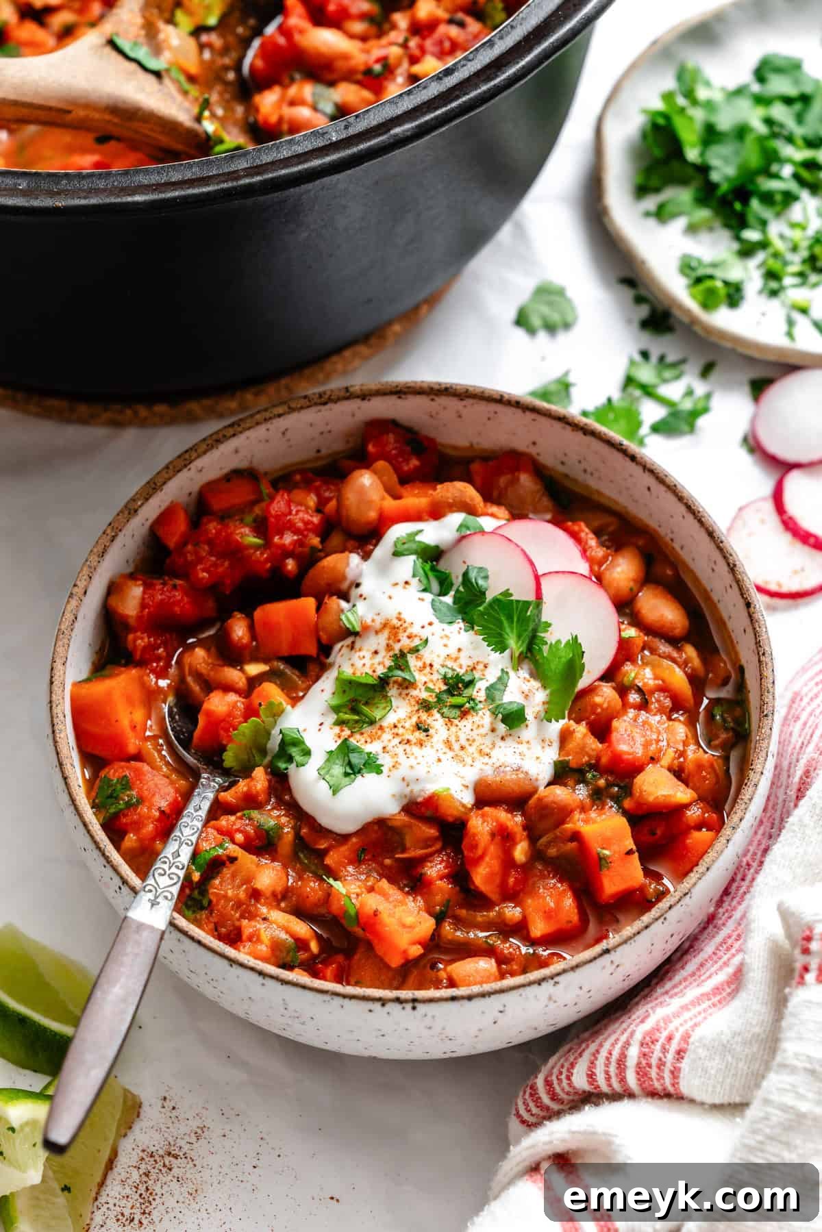 Homemade Vegetarian Chili in a bowl with a spoon, ready to be eaten