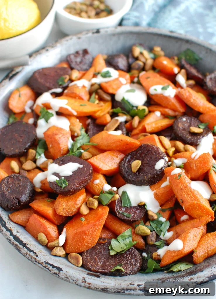 Roasted Carrots and Beets with Tahini on metal plate