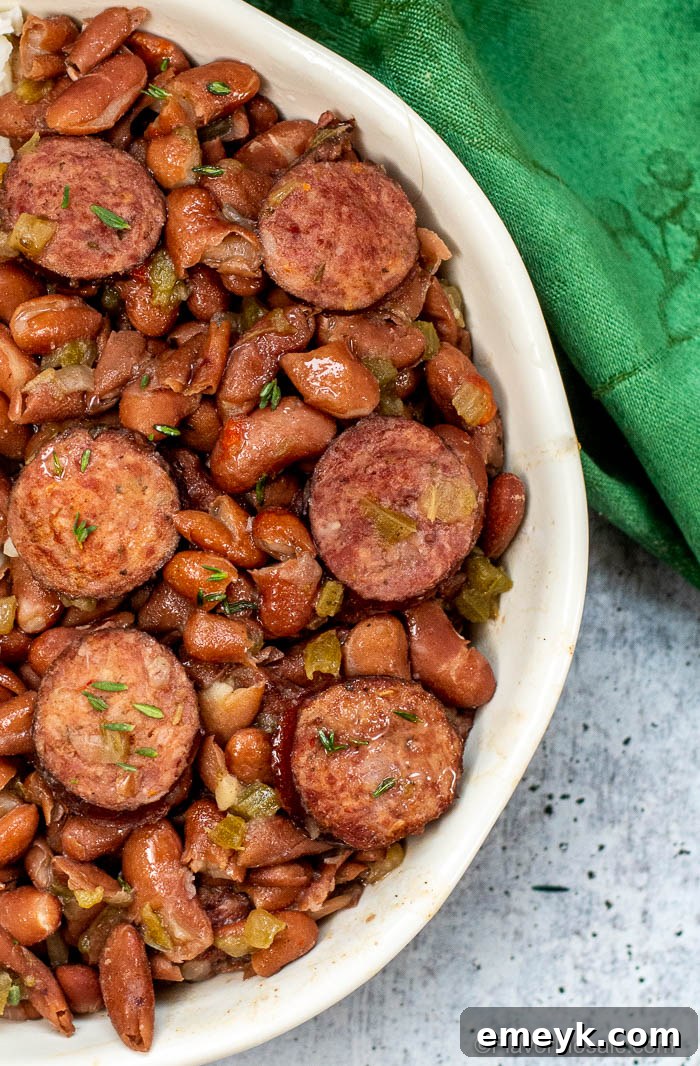 Classic Instant Pot Red Beans And Rice in a bowl with sausage