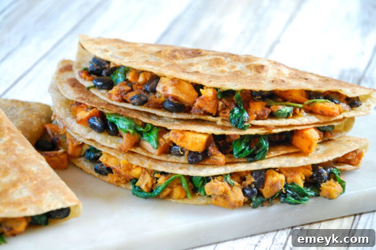 Delicious Black Bean & Sweet Potato Quesadillas on a cutting board