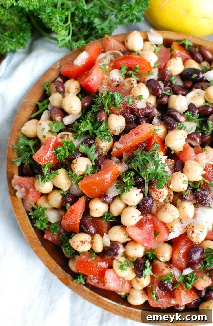 A vibrant bowl of fresh Balela Salad with chickpeas and vegetables