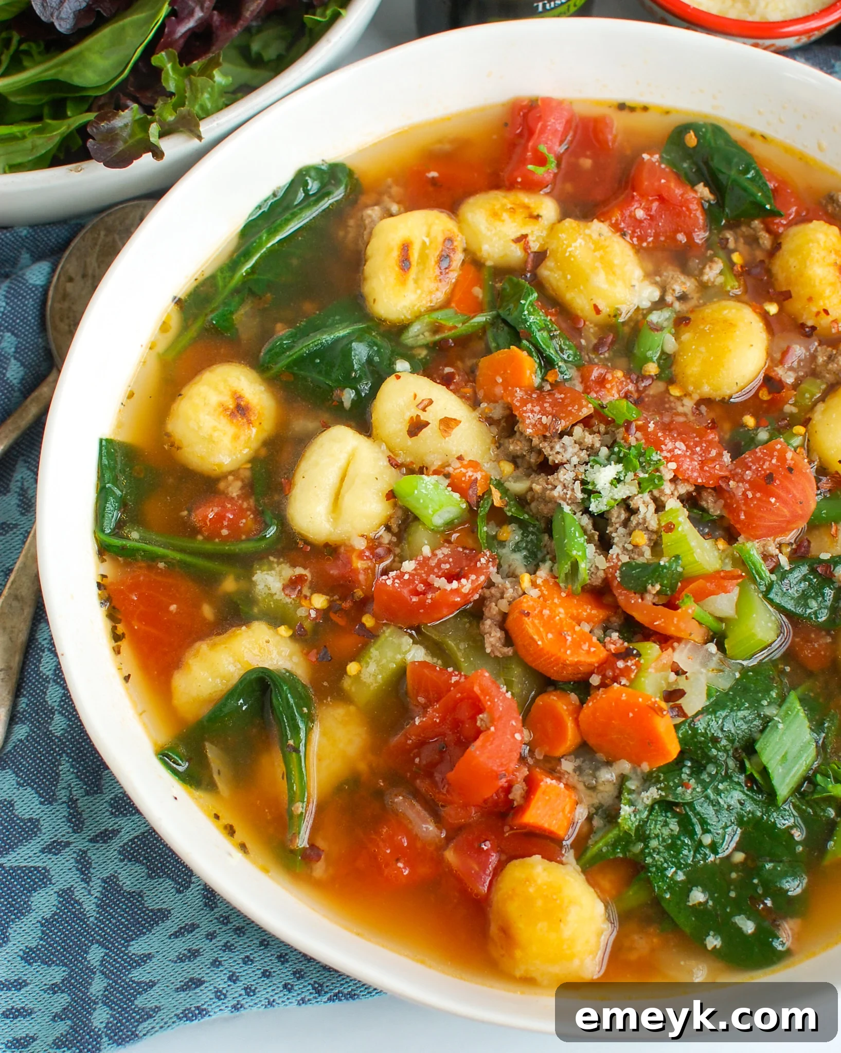 Easy Sausage Gnocchi Soup with spinach, ready to be served in a bowl.