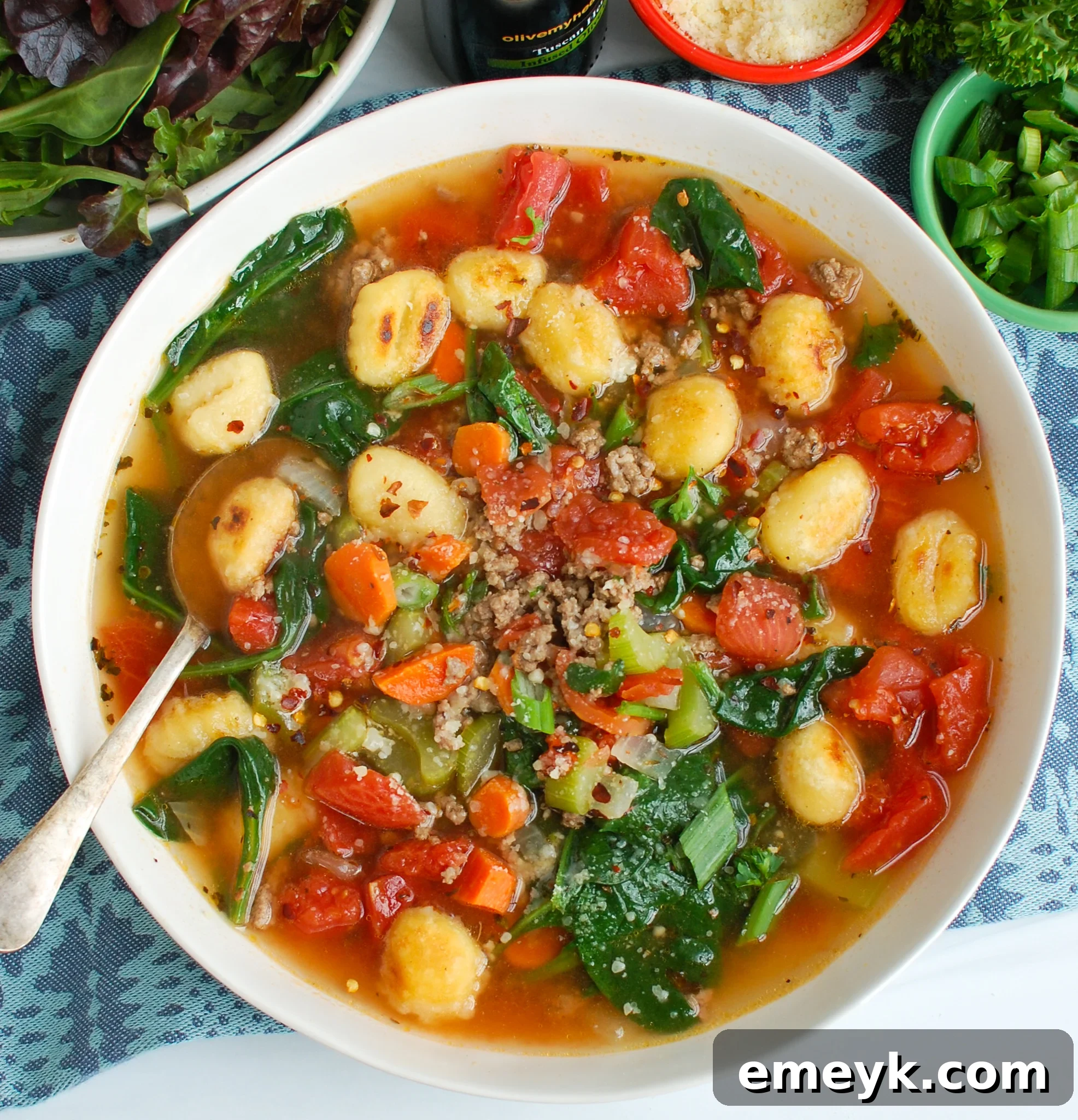 A bowl of Easy Sausage Gnocchi Soup, showcasing the ingredients beautifully arranged.