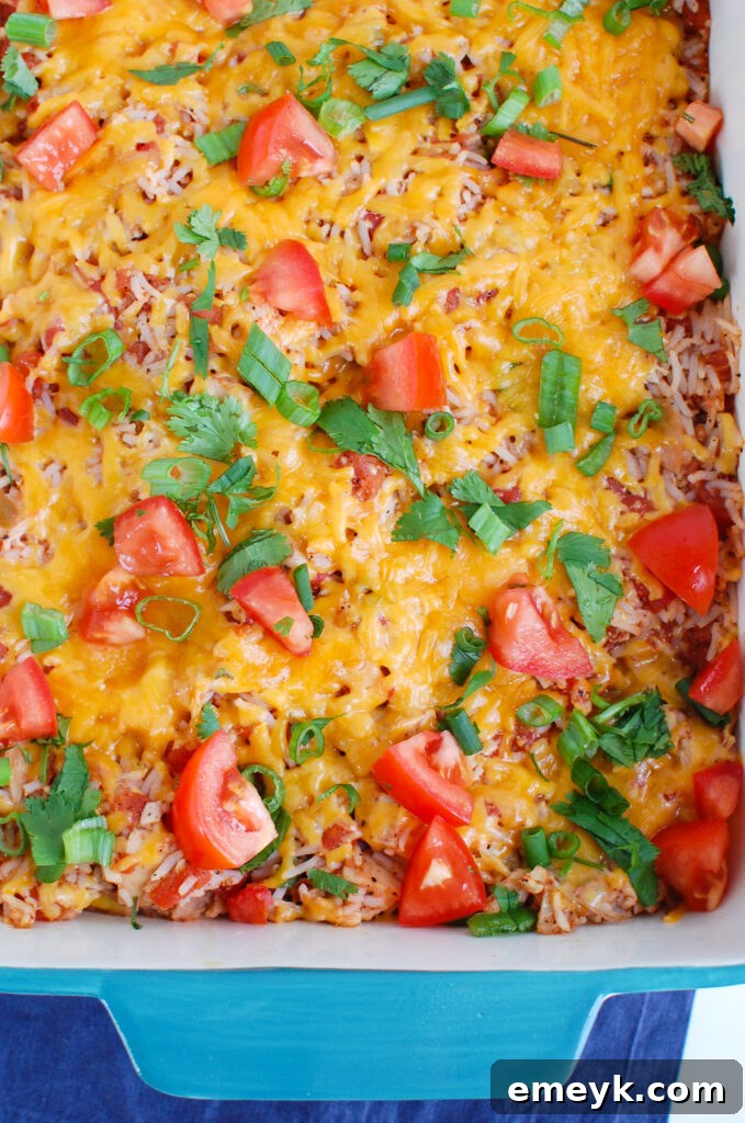 Mexican Chicken Casserole served in a vibrant teal baking dish.