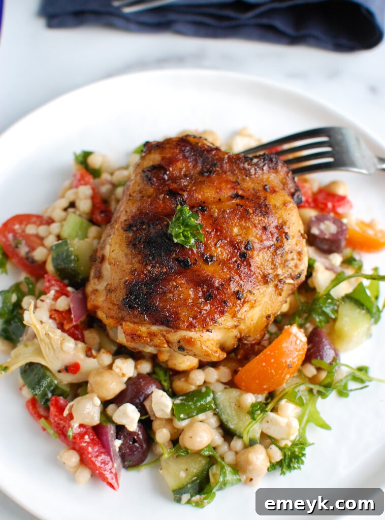 Grilled Chicken Thighs with Greek Marinade on white plate 