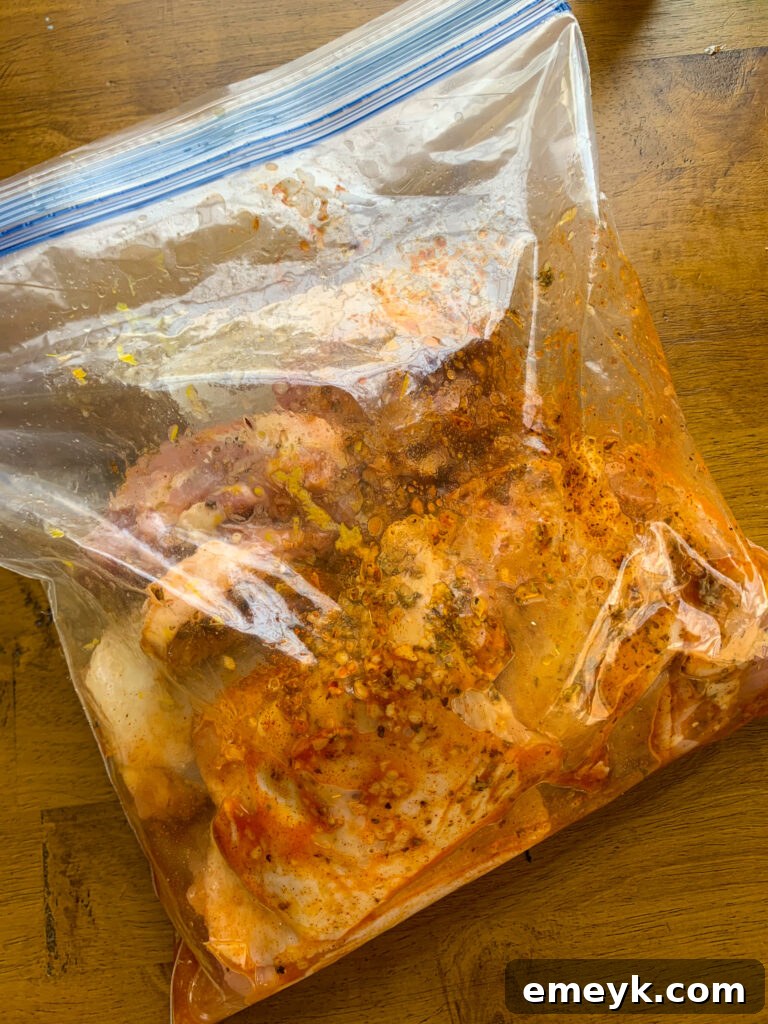 Grilled Chicken Thighs with Greek Marinade in a bag, showing marination