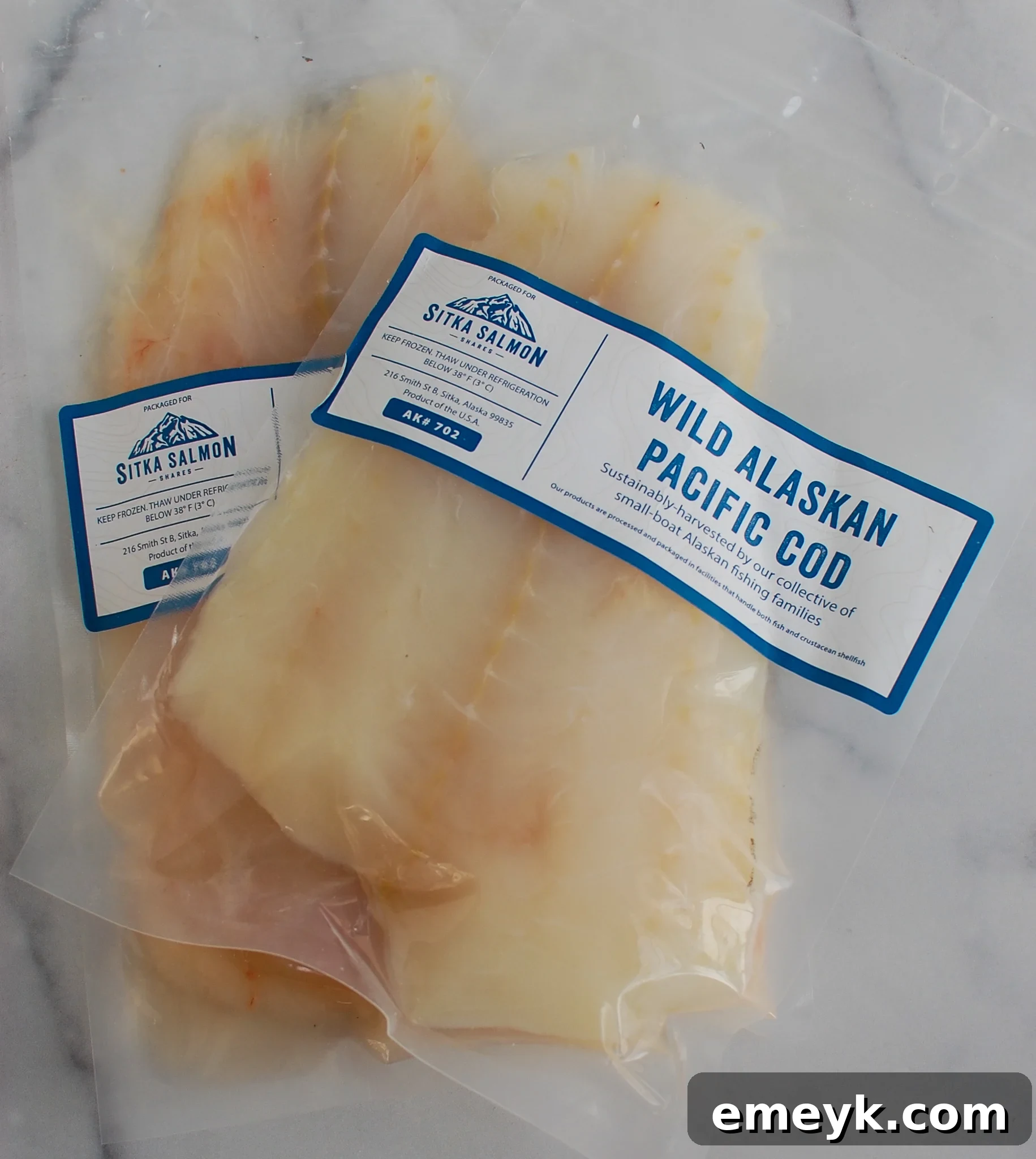 Fresh cod fillets and spices laid out for air frying