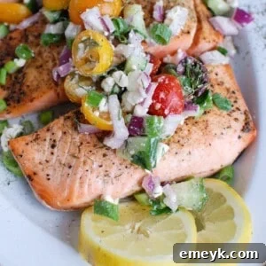 A top-down view of Mediterranean salmon with Greek topping.