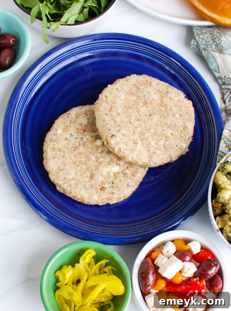Assortment of Greek Chicken Burger toppings in separate bowls