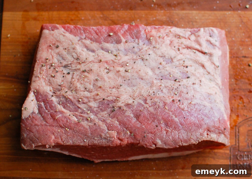 Slow Cooker Beef Brisket in a bowl with a vibrant sauce