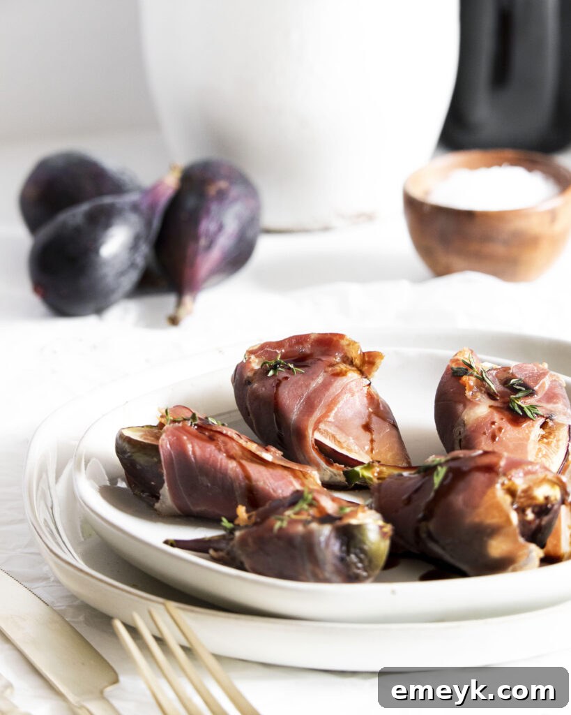 Goat Cheese Figs Wrapped in Prosciutto appetizer on a serving plate