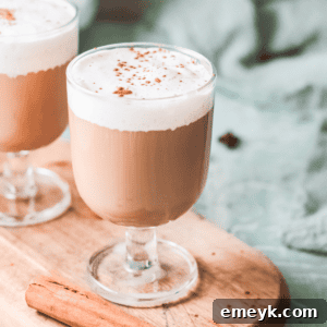 Instant Pot Spiced Chai Latte 8 Instant Pot Chai Tea Latte final serving in a mug, garnished with spices and whipped cream.