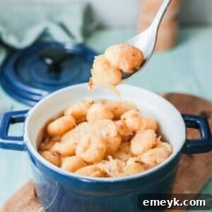 One Pot French Onion Gnocchi in a serving bowl with fresh parsley garnish.