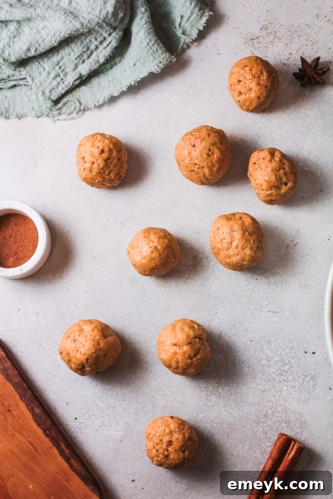Small, uniform dough balls for Air Fryer Donut Holes placed on a cookie sheet.