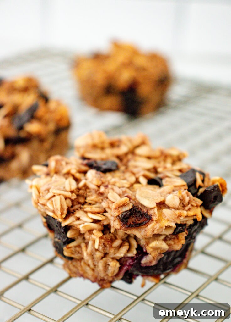 Wholesome Banana Oat Muffins 2 Delicious Banana Oatmeal Muffins cooling on a wire rack, ready for a healthy breakfast or snack.