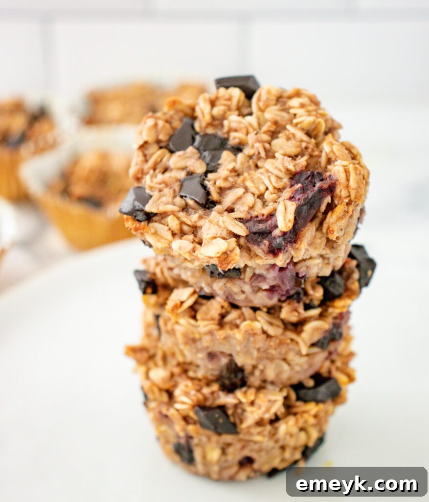 Wholesome Banana Oat Muffins 4 A close-up view of stacked Banana Oatmeal Muffins, highlighting their texture and the visible oats and chocolate chips.