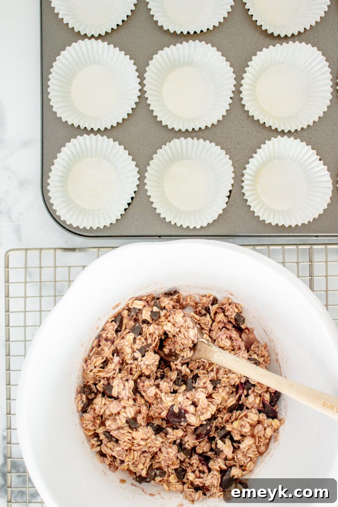 Wholesome Banana Oat Muffins 8 Banana Oatmeal Muffin batter in a mixing bowl, ready to be scooped into muffin liners.