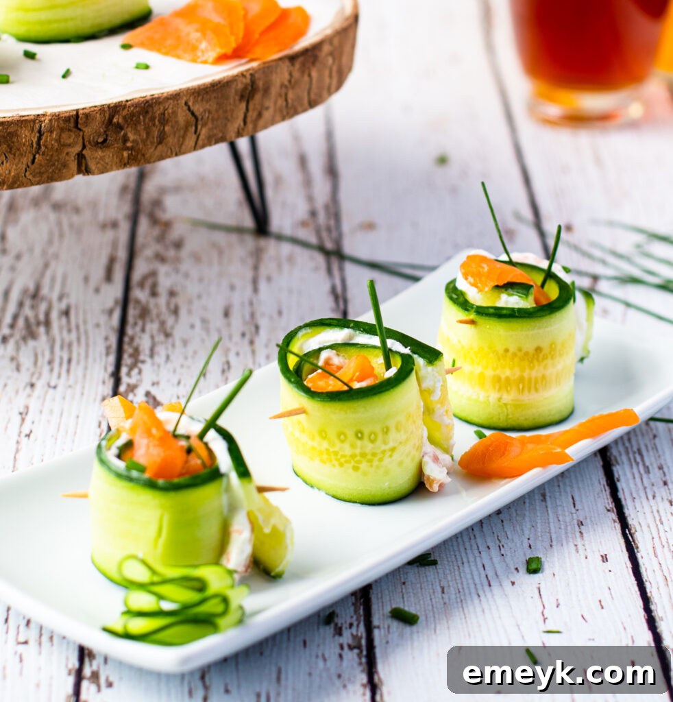 Smoked Salmon Cucumber Appetizer Bites beautifully arranged on a white plate