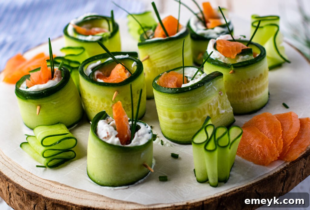 Smoked Salmon Cucumber Appetizer Bites served on a rustic wood platter