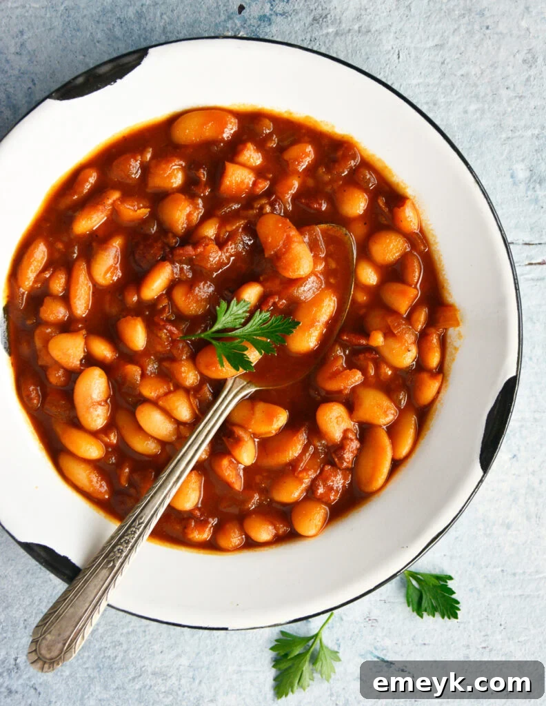 Easy Bacon Baked Beans in a rustic serving bowl