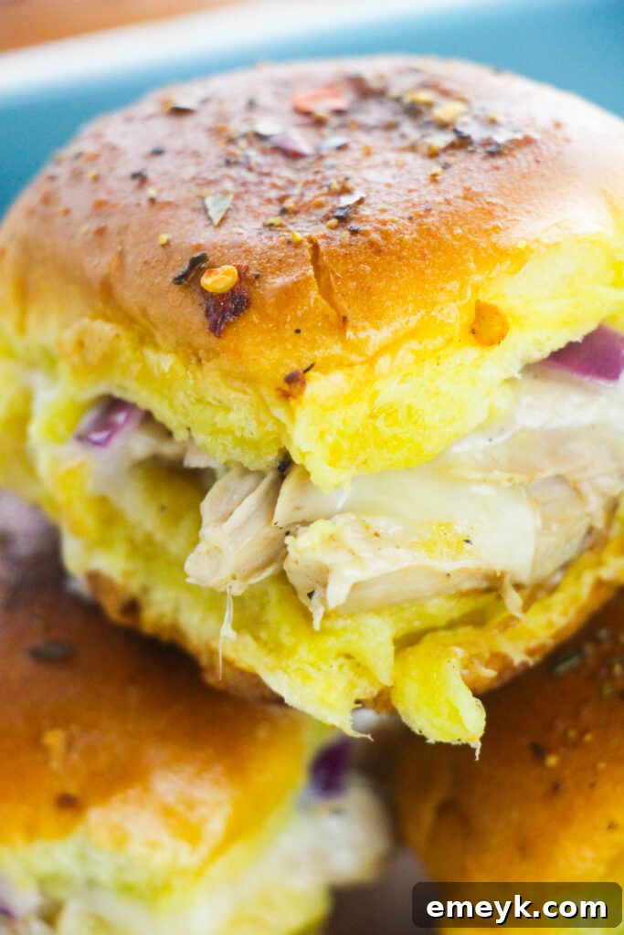 Simple Savory Chicken Sliders 6 Easy Chicken Sliders up close, showing the melted cheese and toppings