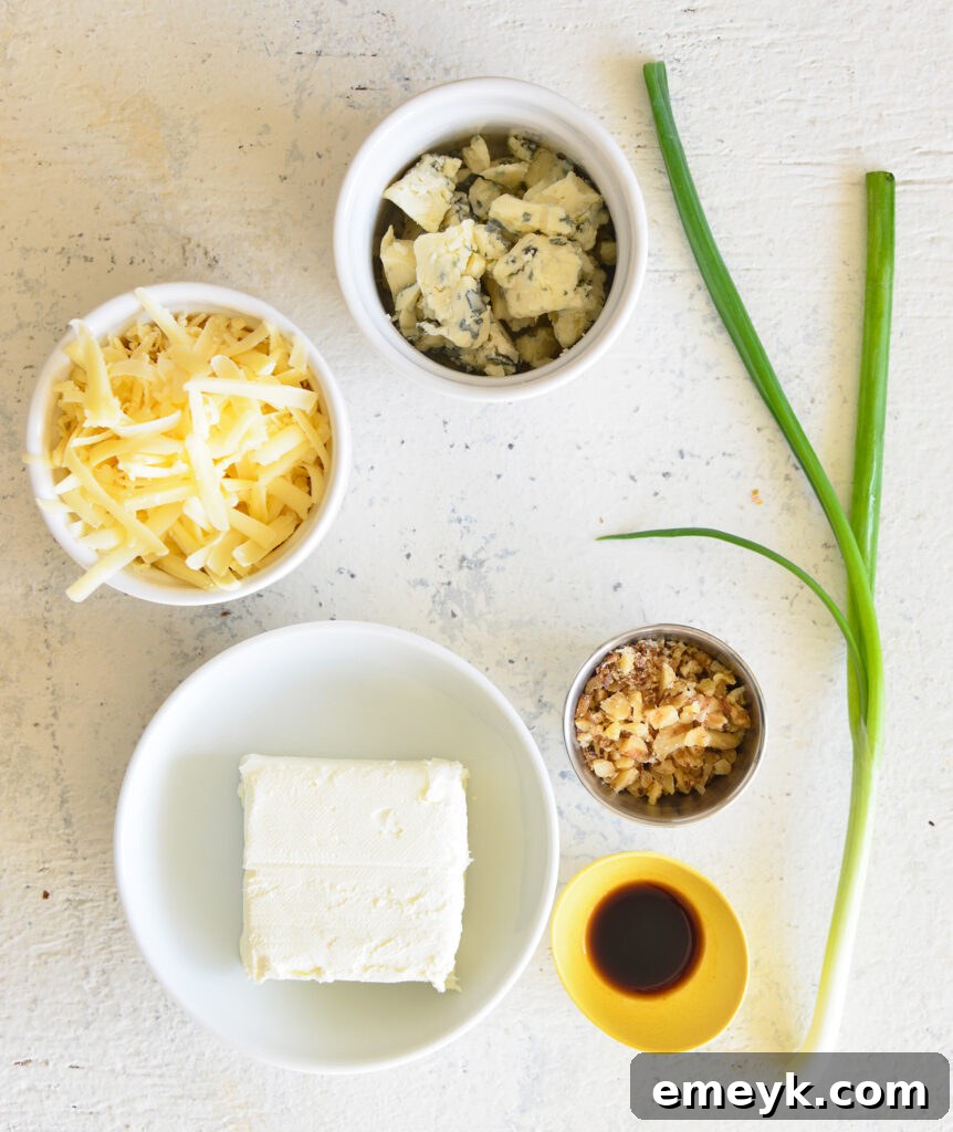 Crafting the Perfect Cheese Ball 4 All the fresh ingredients for making a cheese ball laid out on a wooden cutting board.