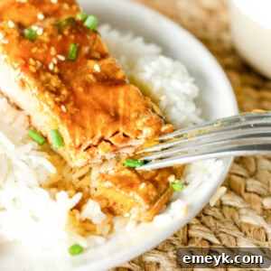 Perfect Glazed Teriyaki Salmon 9 Teriyaki Salmon with a fork, ready to be eaten